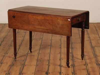 Lot 557 - A Regency mahogany pembroke table, on ring...