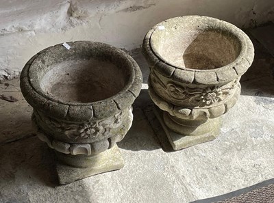 Lot 551 - A pair of reconstituted stone garden planters