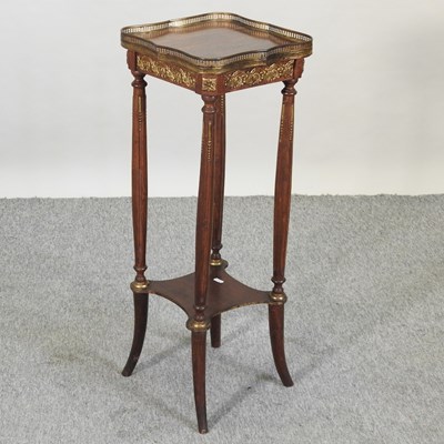 Lot 635 - A French gilt metal mounted two tier stand