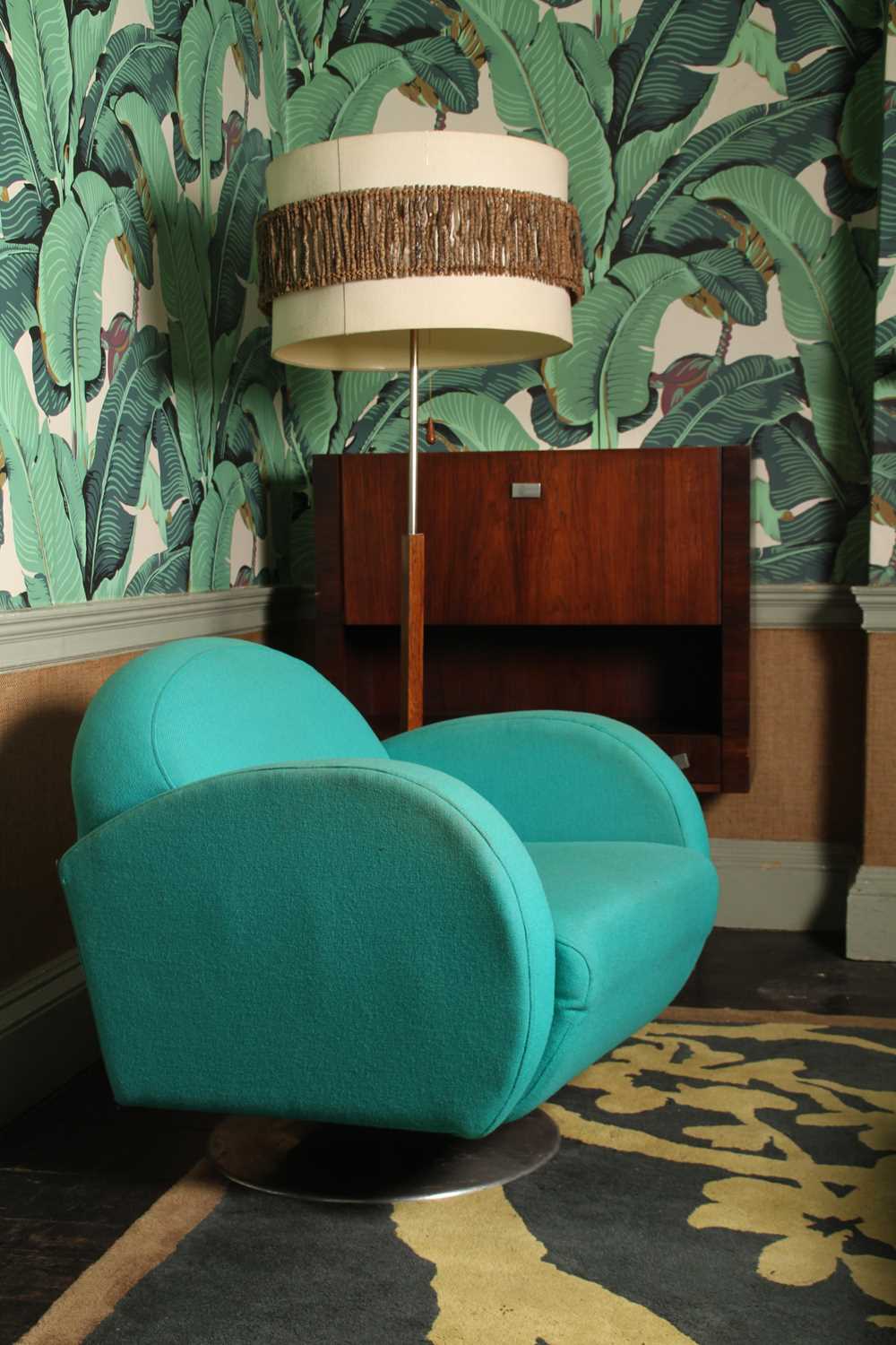 Lot 5 - A pair of 1970's style blue upholstered swivel...