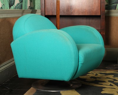 Lot 5 - A pair of 1970's style blue upholstered swivel...