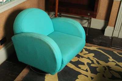 Lot 5 - A pair of 1970's style blue upholstered swivel...