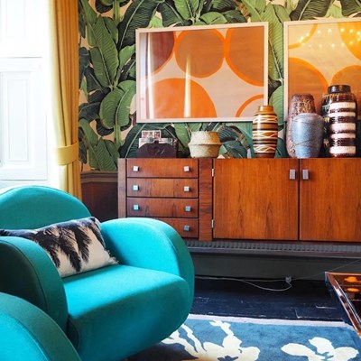 Lot 5 - A pair of 1970's style blue upholstered swivel...