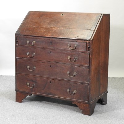Lot 656 - A George III oak bureau
