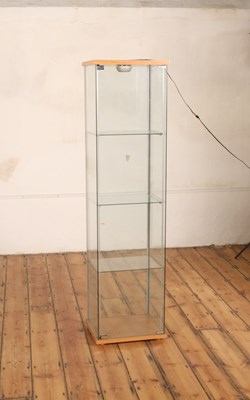 Lot 575 - A modern glazed display cabinet, fitted with a...