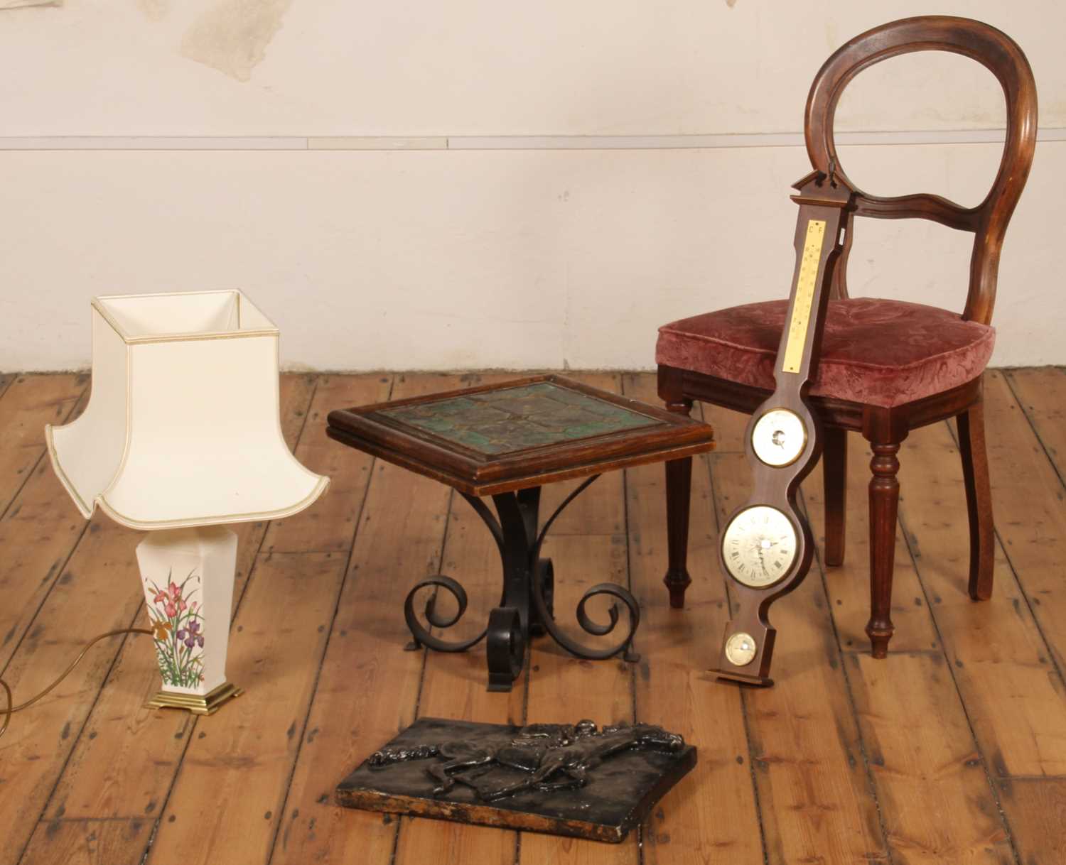 Lot 437 - A tile-top table on wrought iron legs,...