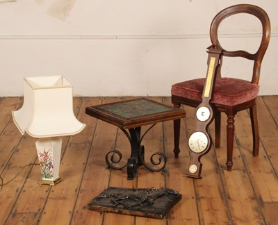 Lot 437 - A tile-top table on wrought iron legs,...