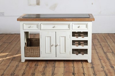 Lot 556 - A cream painted oak kitchen island, with a...