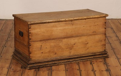 Lot 584 - A large pine blanket box, flanked by iron...