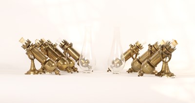 Lot 415 - A collection of eight brass gimbal lamps (8)