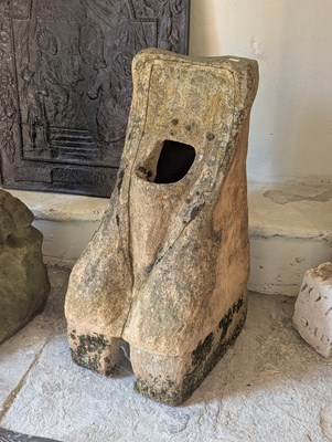 Lot 523 - A terracotta urinal, decorated with a mask...