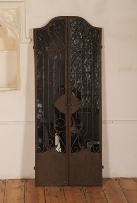 Lot 568 - A painted metal framed wall mirror, in the...