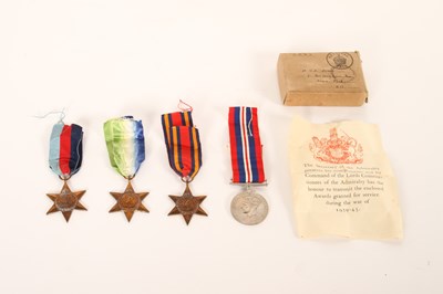 Lot 289 - A group of four World War II medals, to...