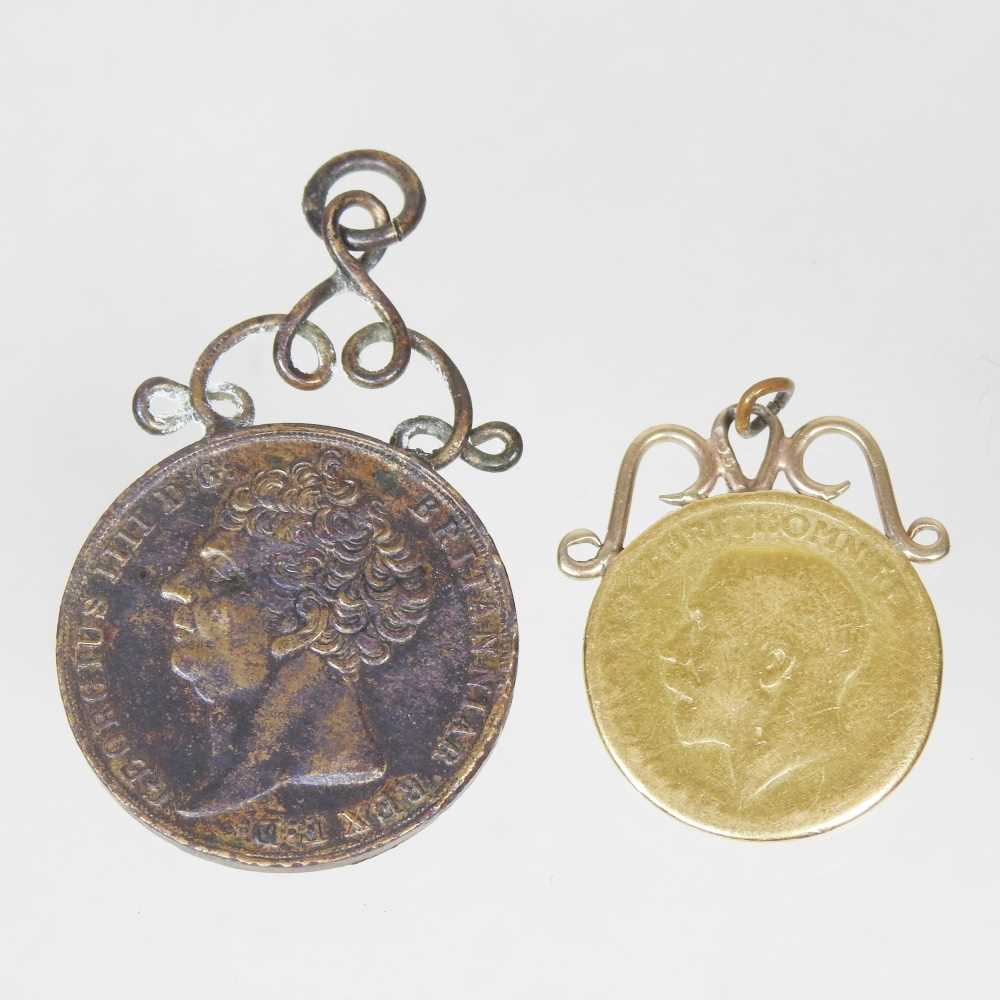 Lot 41 - A George V sovereign, mounted in 9 carat gold...