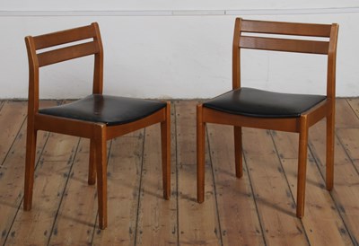 Lot 579 - A pair of teak bar back dining chairs,...