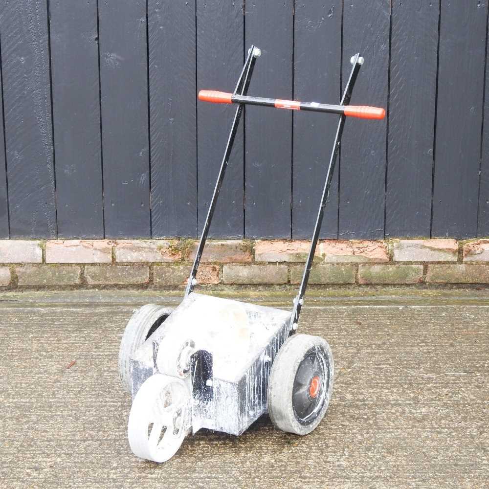 Lot 274 - A push along garden line maker
