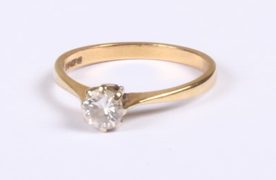Lot 225 - An 18 carat yellow gold diamond solitaire ring,...