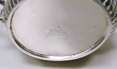 Lot 6 - A Victorian silver teapot, of oval shape with...