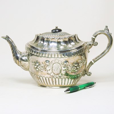 Lot 6 - A Victorian silver teapot, of oval shape with...