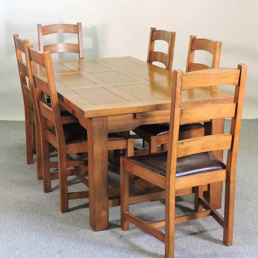 Lot 665 - A modern oak dining table