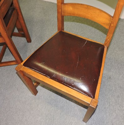 Lot 665 - A modern oak dining table