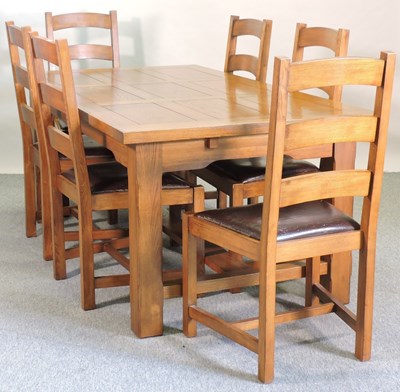 Lot 665 - A modern oak dining table