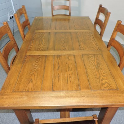 Lot 665 - A modern oak dining table