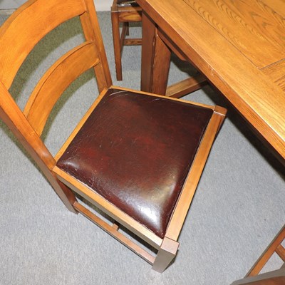 Lot 665 - A modern oak dining table