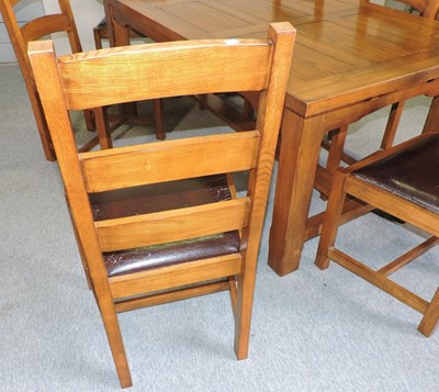 Lot 665 - A modern oak dining table