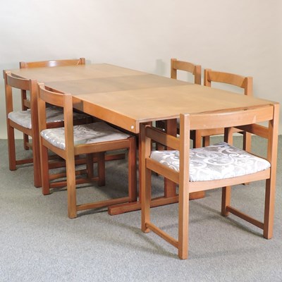 Lot 719 - A 1970's teak extending dining table