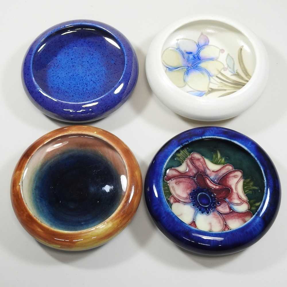 Lot 20 - A collection of four Moorcroft pottery pin dishes
