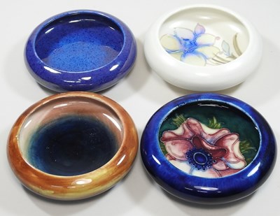 Lot 20 - A collection of four Moorcroft pottery pin dishes
