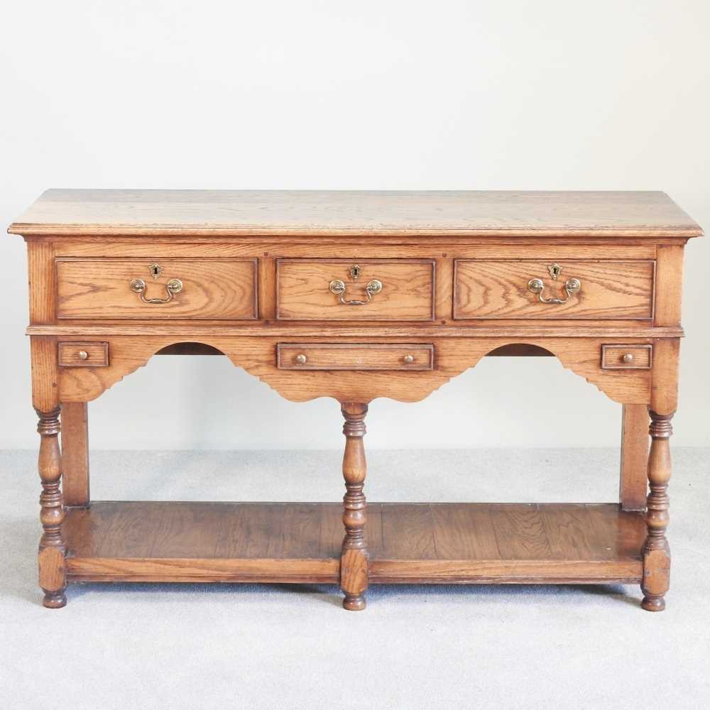Lot 11 - An oak dresser base, of 18th century design,...