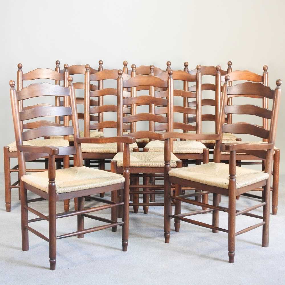 Lot 35 - A set of ten oak ladderback dining chairs,...