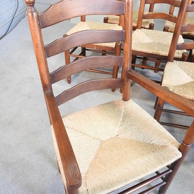 Lot 35 - A set of ten oak ladderback dining chairs,...