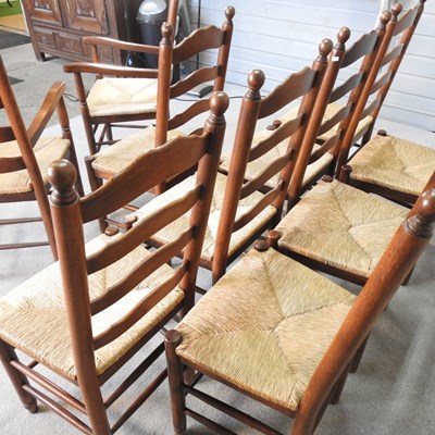 Lot 35 - A set of ten oak ladderback dining chairs,...