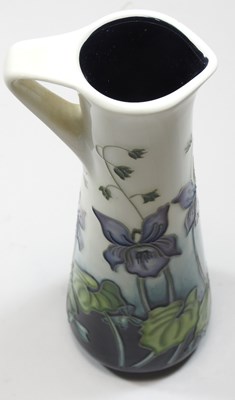 Lot 77 - A modern Moorcroft pottery 'Dog Violet' pattern ewer