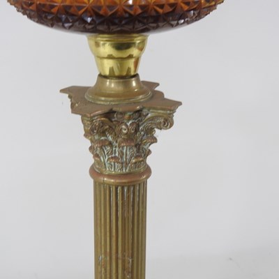 Lot 28 - A 19th century brass oil lamp, in the form of...