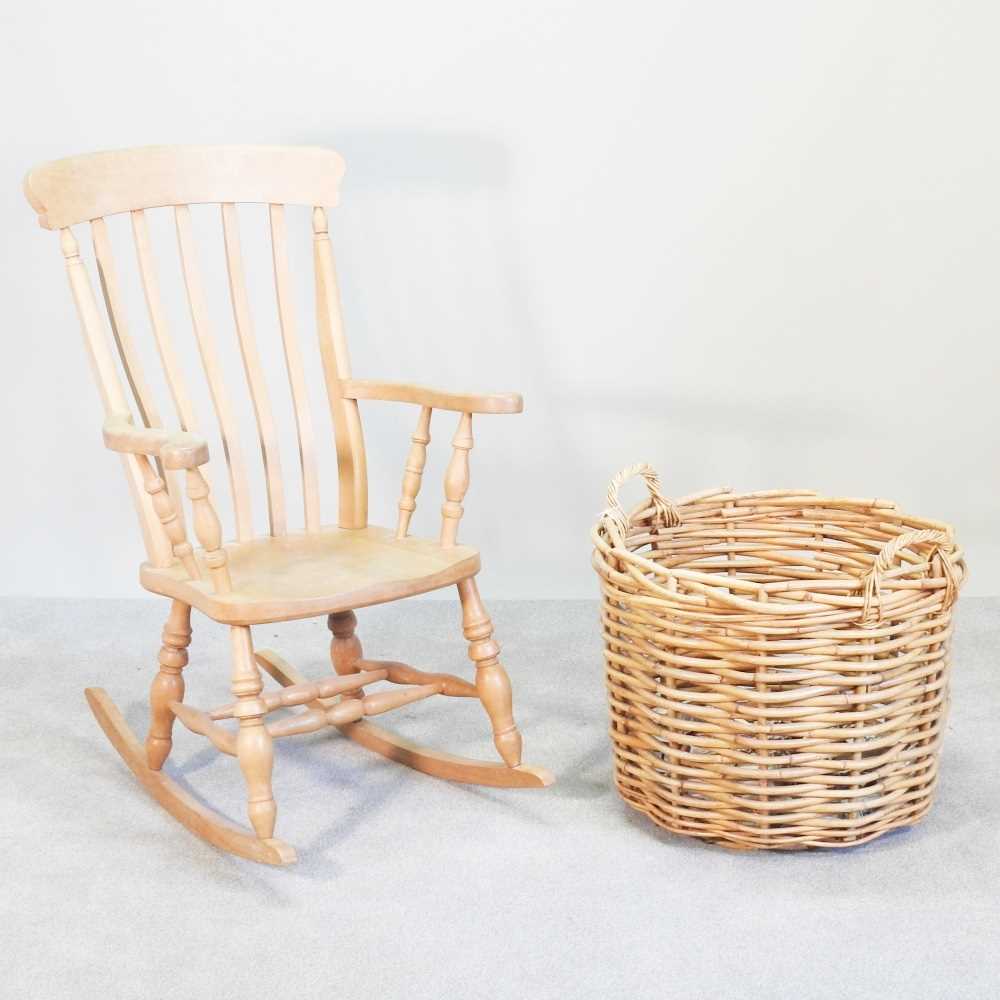 Lot 254 - A beech splat back rocking chair, together...