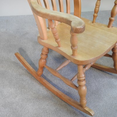Lot 254 - A beech splat back rocking chair, together...