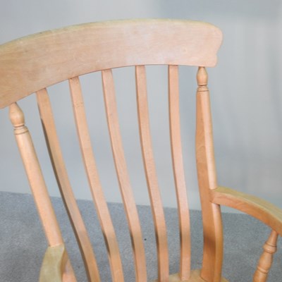 Lot 254 - A beech splat back rocking chair, together...