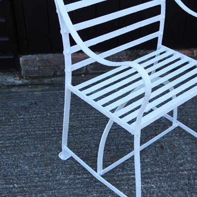 Lot 1 - A pair of Regency style white painted wrought...
