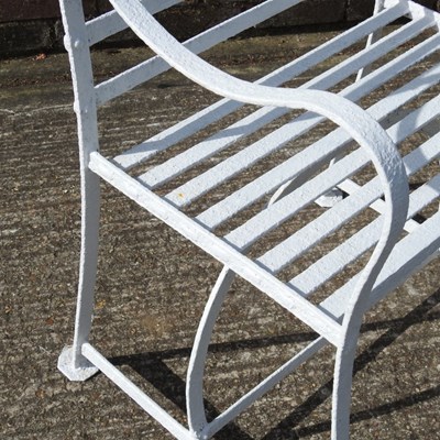 Lot 1 - A pair of Regency style white painted wrought...