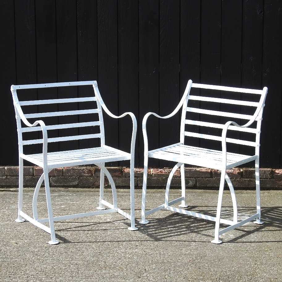 Lot 1 - A pair of Regency style white painted wrought...