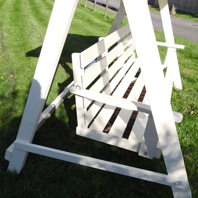 Lot 5 - A white painted wooden three seater swinging...
