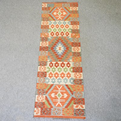 Lot 253 - A kelim runner