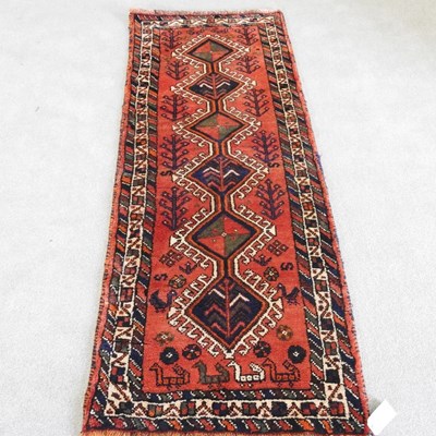 Lot 143 - A Persian lori runner, with a central row of...