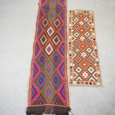 Lot 394 - A kelim runner