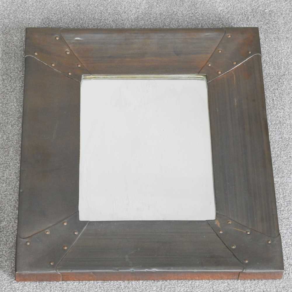 Lot 260 - An Arts and Crafts style copper framed wall...