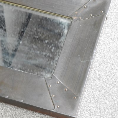 Lot 260 - An Arts and Crafts style copper framed wall...